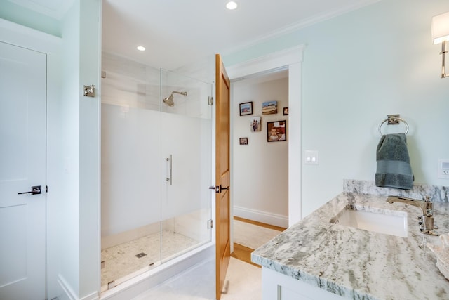 2 Bridge St, East Falmouth, MA 02536 - full bath with a stall shower, vanity, recessed lighting, baseboards, and ornamental molding