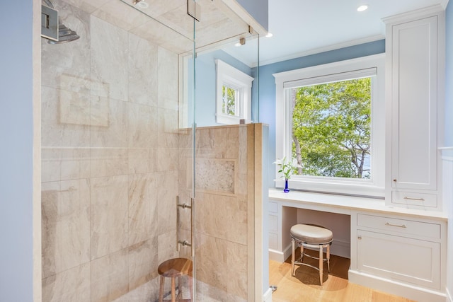 2 Bridge St, East Falmouth, MA 02536 - bathroom featuring a shower stall, ornamental molding, and wood finished floors