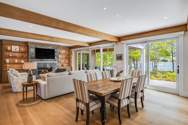 2 Bridge St, East Falmouth, MA 02536 - dining space with light wood-style floors, beam ceiling, a fireplace, and recessed lighting