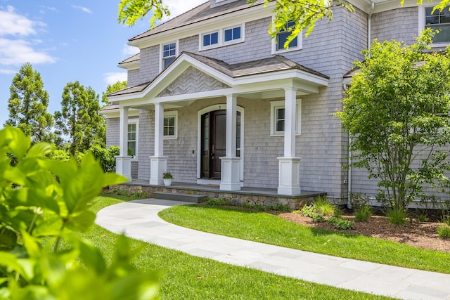 2 Bridge St, East Falmouth, MA 02536 - view of front facade with covered porch and a front lawn