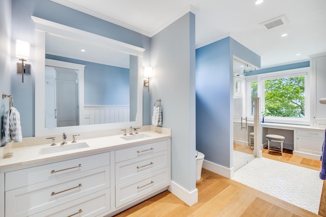 2 Bridge St, East Falmouth, MA 02536 - full bathroom featuring toilet, double vanity, wood finished floors, crown molding, and recessed lighting