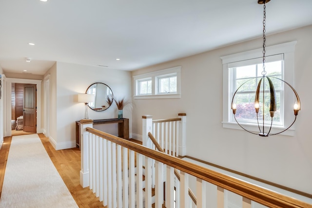 2 Bridge St, East Falmouth, MA 02536 - hall featuring an upstairs landing, light wood-style floors, recessed lighting, and baseboards