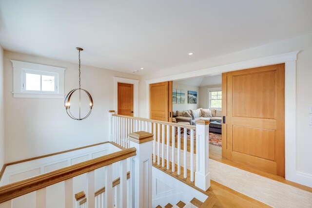 2 Bridge St, East Falmouth, MA 02536 - hall with a chandelier, an upstairs landing, light wood-type flooring, and recessed lighting