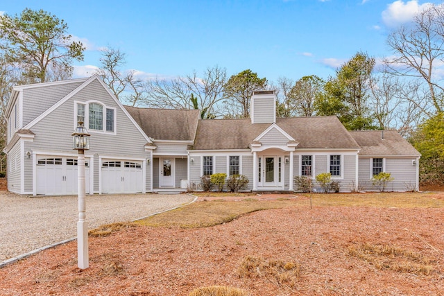 cape cod house with a garage