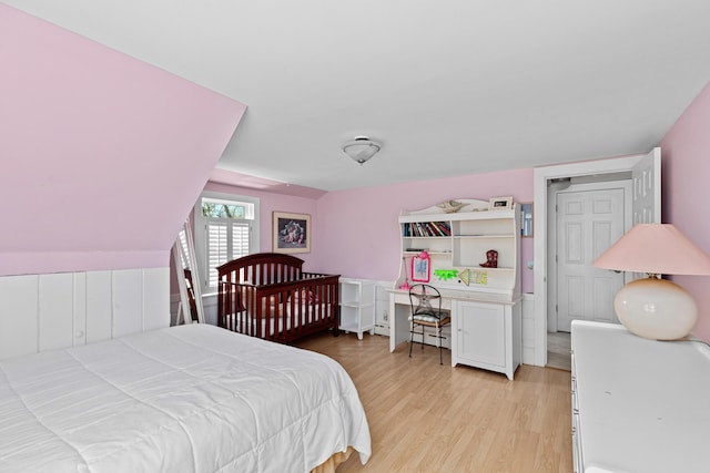 bedroom with light hardwood / wood-style flooring