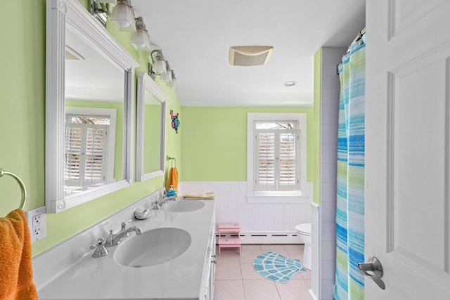 bathroom with vanity, a baseboard radiator, tile patterned floors, and toilet