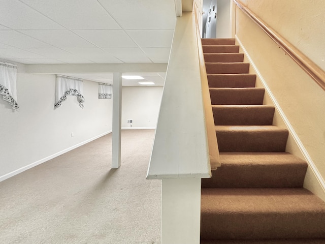 stairs featuring carpet floors and baseboards