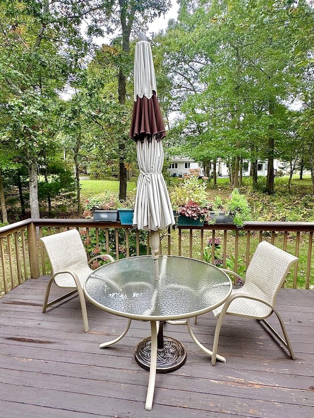 wooden deck with outdoor dining space