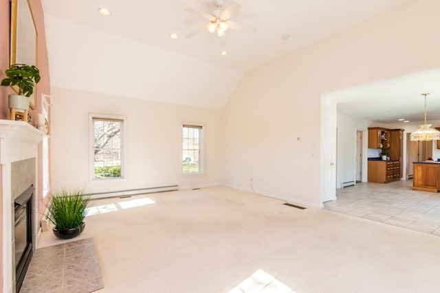 unfurnished living room featuring ceiling fan, light colored carpet, visible vents, a tiled fireplace, and a baseboard radiator