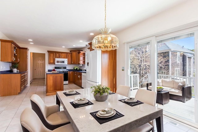 dining room featuring light tile patterned floors and recessed lighting
