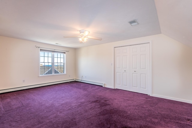 unfurnished bedroom featuring visible vents, a closet, ceiling fan, carpet, and lofted ceiling