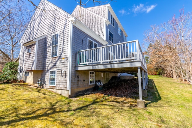 view of side of home with a yard and a wooden deck