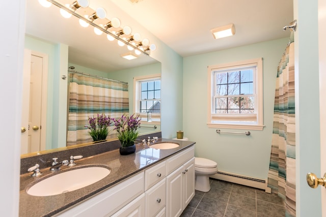 full bathroom featuring a sink, a wealth of natural light, and baseboard heating