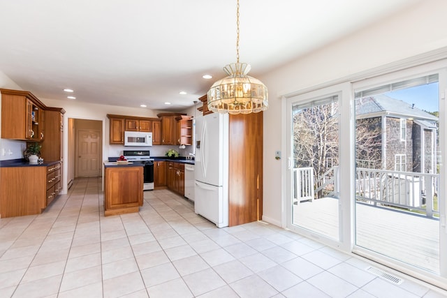 kitchen featuring open shelves, dark countertops, white appliances, brown cabinets, and recessed lighting