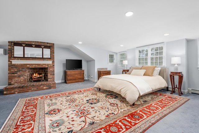 bedroom with carpet flooring, a fireplace, recessed lighting, an AC wall unit, and baseboards