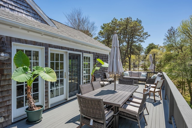 wooden terrace featuring an outdoor hangout area and outdoor dining area