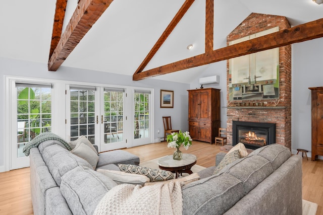 living area featuring a wall mounted AC, high vaulted ceiling, french doors, light wood finished floors, and beam ceiling