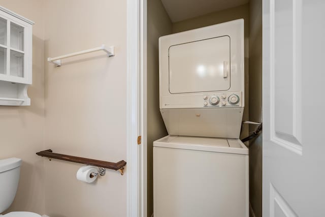 washroom with stacked washer and clothes dryer