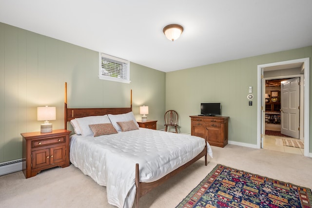 bedroom with light carpet and a baseboard radiator