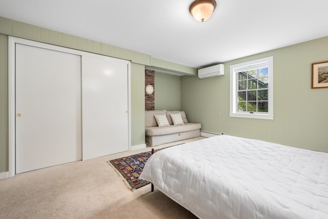 bedroom with a wall unit AC, carpet, and a baseboard heating unit
