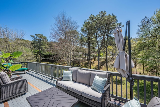 wooden terrace with outdoor lounge area