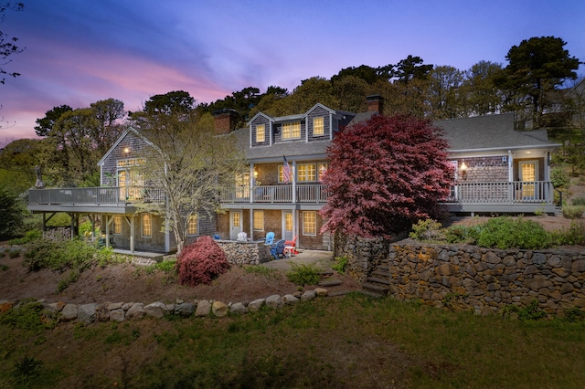 55 Winterset Dr, Chatham, MA 02633 - back of house featuring a chimney and a balcony