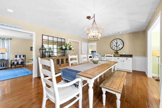 67 Sea Meadow Cir, Centerville, MA 02632 - dining area with light wood-type flooring, plenty of natural light, a chandelier, recessed lighting, and a wainscoted wall