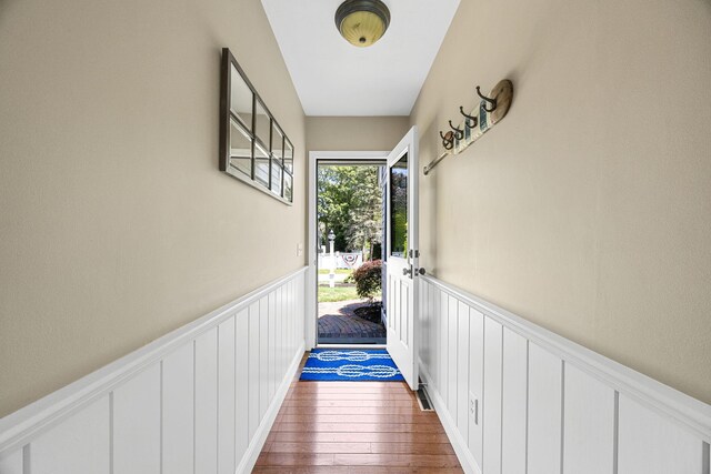 67 Sea Meadow Cir, Centerville, MA 02632 - entryway with a decorative wall, a wainscoted wall, and wood finished floors