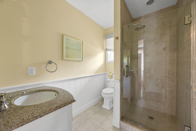 67 Sea Meadow Cir, Centerville, MA 02632 - full bath with a shower stall, tile patterned flooring, wainscoting, and vanity