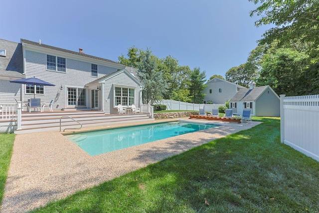 67 Sea Meadow Cir, Centerville, MA 02632 - view of swimming pool featuring a fenced backyard, an outbuilding, a patio area, and a deck