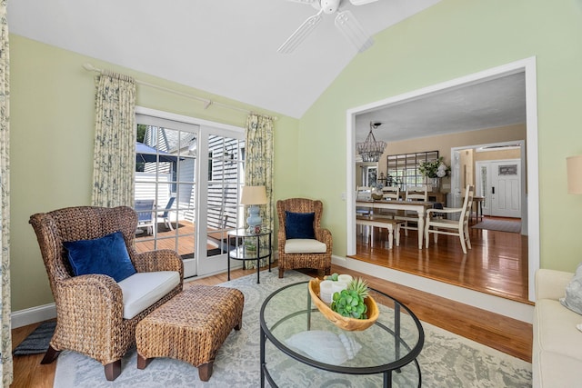 67 Sea Meadow Cir, Centerville, MA 02632 - living room featuring lofted ceiling, ceiling fan, wood finished floors, and a chandelier