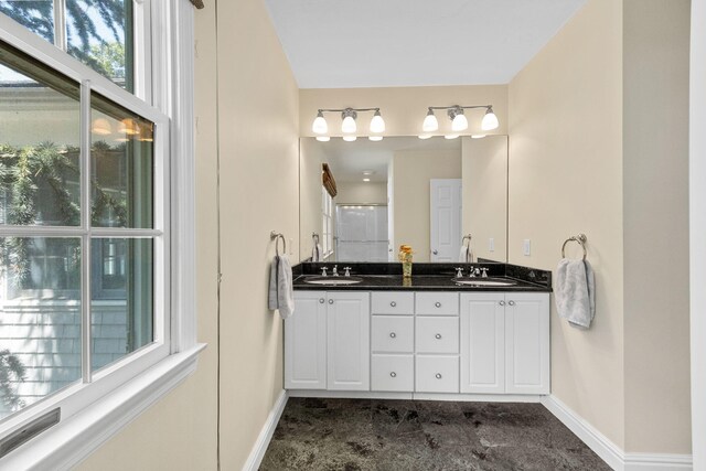 67 Sea Meadow Cir, Centerville, MA 02632 - bathroom with baseboards and double vanity