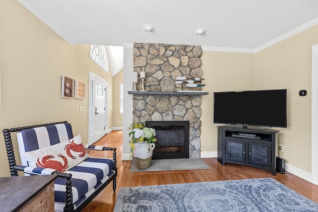 67 Sea Meadow Cir, Centerville, MA 02632 - living room with a stone fireplace, ornamental molding, and wood finished floors