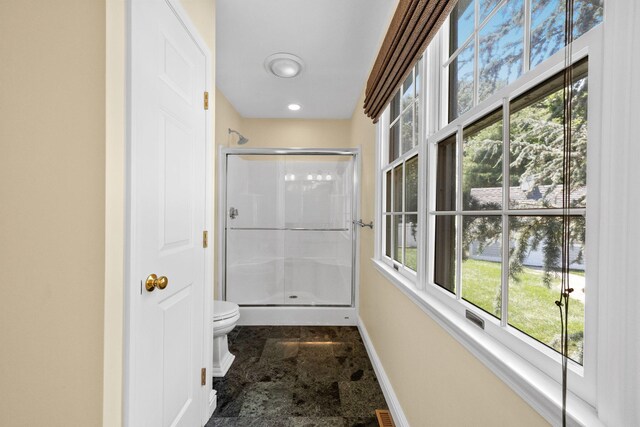 67 Sea Meadow Cir, Centerville, MA 02632 - corridor with dark stone finish flooring and healthy amount of natural light