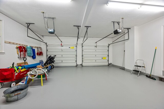 67 Sea Meadow Cir, Centerville, MA 02632 - garage with a garage door opener
