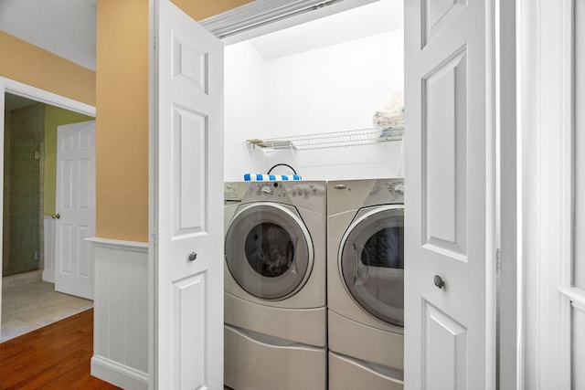67 Sea Meadow Cir, Centerville, MA 02632 - laundry room with washer and clothes dryer and wood finished floors