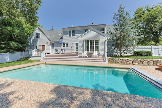 67 Sea Meadow Cir, Centerville, MA 02632 - view of pool with a wooden deck, a fenced backyard, and outdoor dining space
