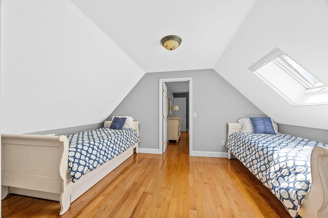 67 Sea Meadow Cir, Centerville, MA 02632 - bedroom with a skylight, light wood-type flooring, and lofted ceiling
