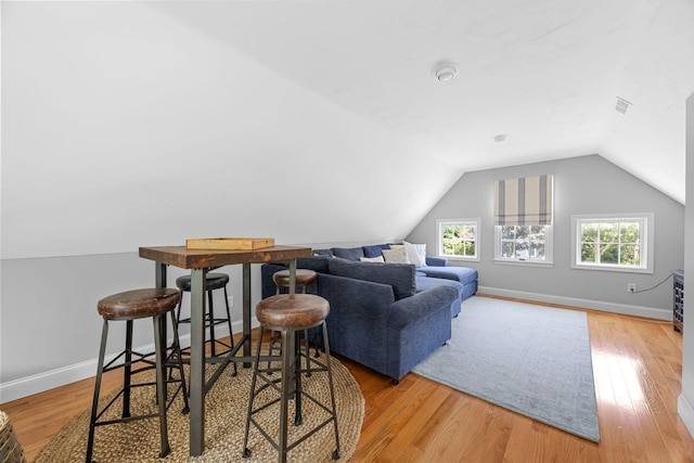 67 Sea Meadow Cir, Centerville, MA 02632 - living room with vaulted ceiling and light wood-style flooring