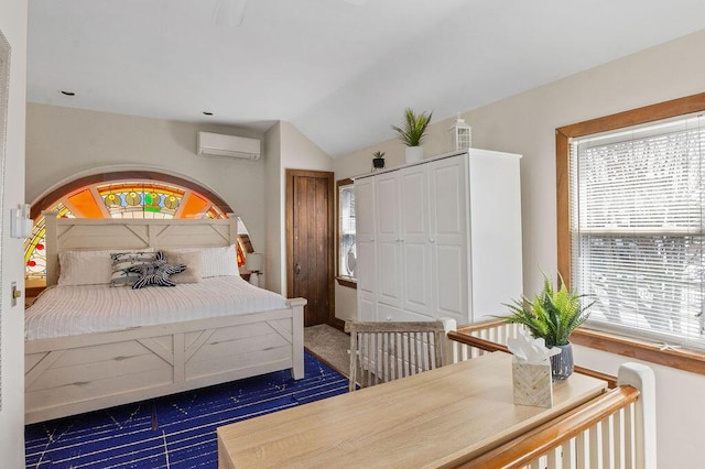 bedroom featuring a wall unit AC and lofted ceiling