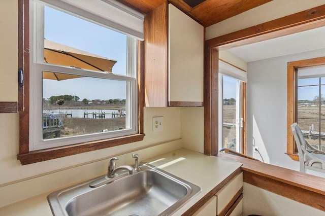 kitchen featuring a sink and light countertops