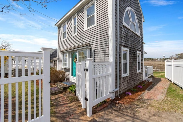 view of property exterior featuring fence