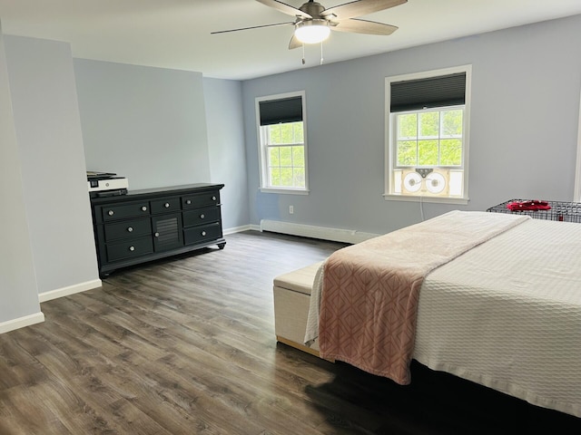 50 Great Hill Rd, Sandwich, MA 02563 - bedroom featuring a baseboard heating unit, dark wood-type flooring, baseboards, and ceiling fan