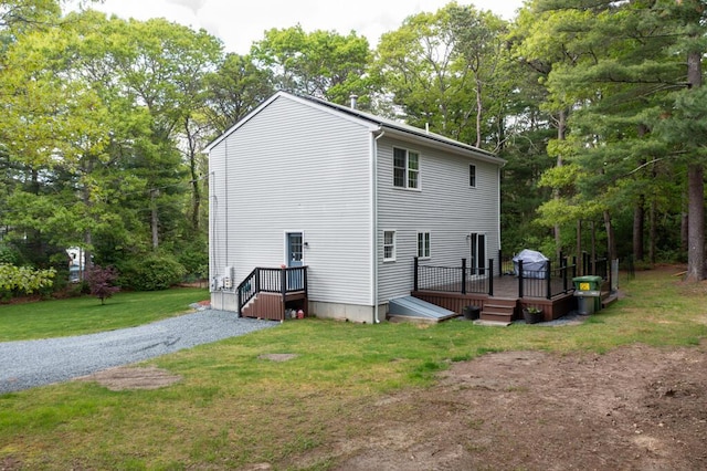 50 Great Hill Rd, Sandwich, MA 02563 - back of property with a yard, a deck, and view of wooded area