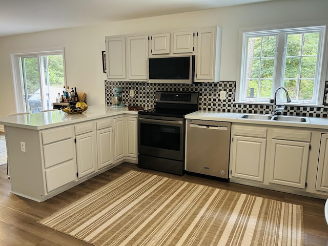 50 Great Hill Rd, Sandwich, MA 02563 - kitchen with stainless steel appliances, a sink, light countertops, and tasteful backsplash