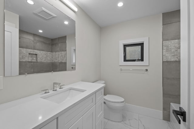 bathroom featuring vanity and toilet