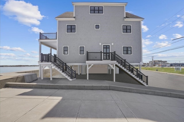 rear view of house with a water view