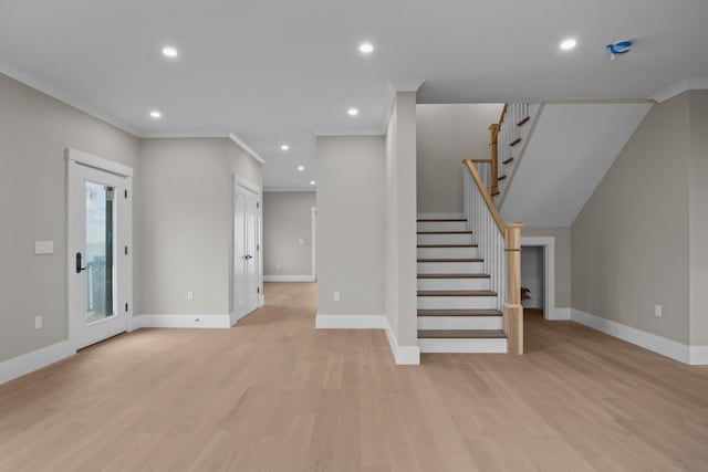 unfurnished living room with light wood-type flooring and crown molding