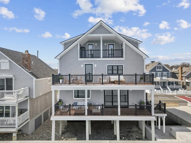 rear view of property with a balcony