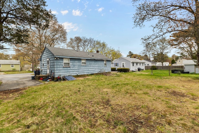 74 Fearing St, Buzzards Bay, MA 02532 - rear view of house with a chimney
